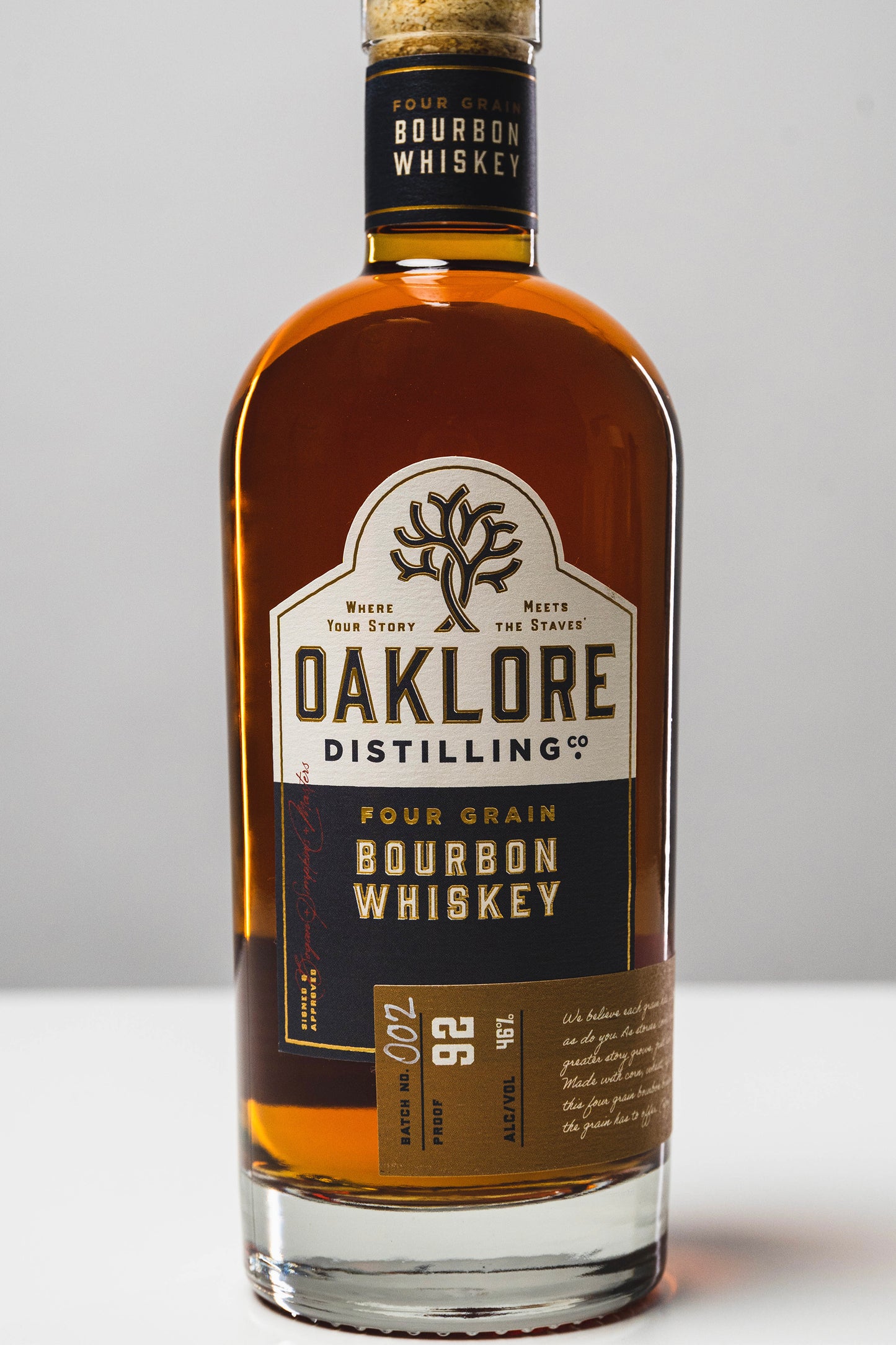 Close up shot of the Oaklore Distilling Co. Four Grain Bourbon Whiskey bottle label.